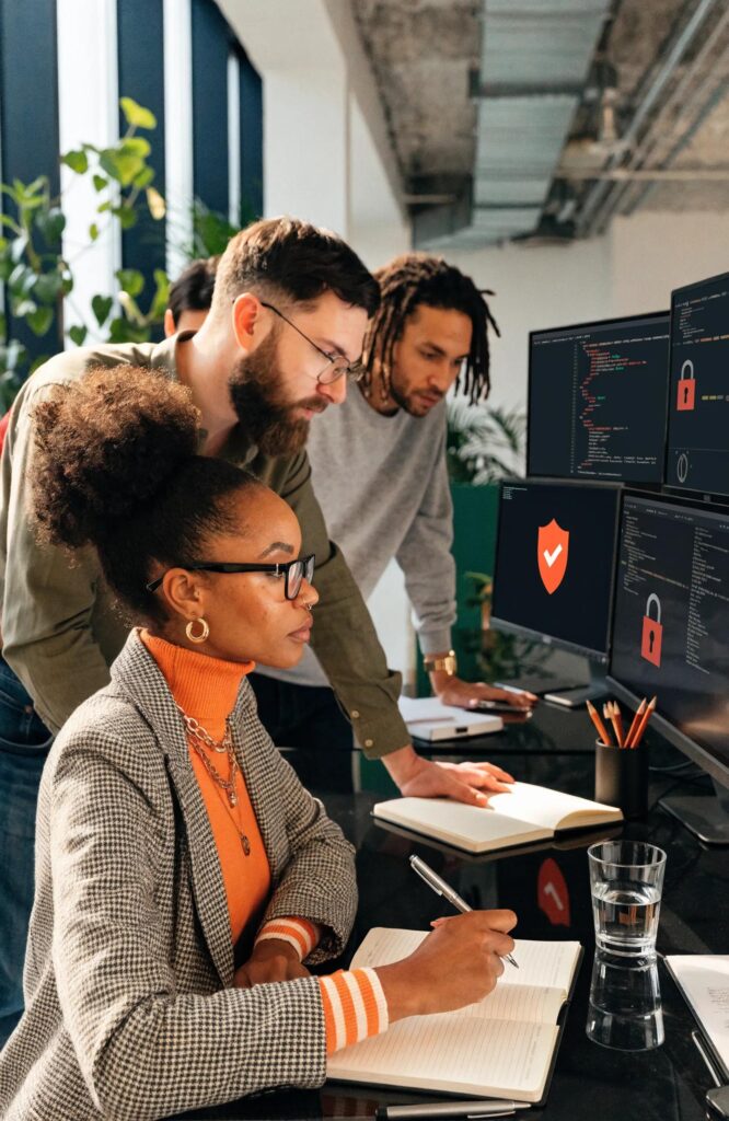 Engaged professionals collaborating on cybersecurity solutions in a modern office environment